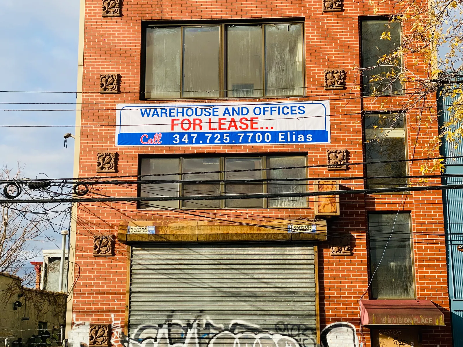 Warehouse and offices for lease banner on Brooklyn building