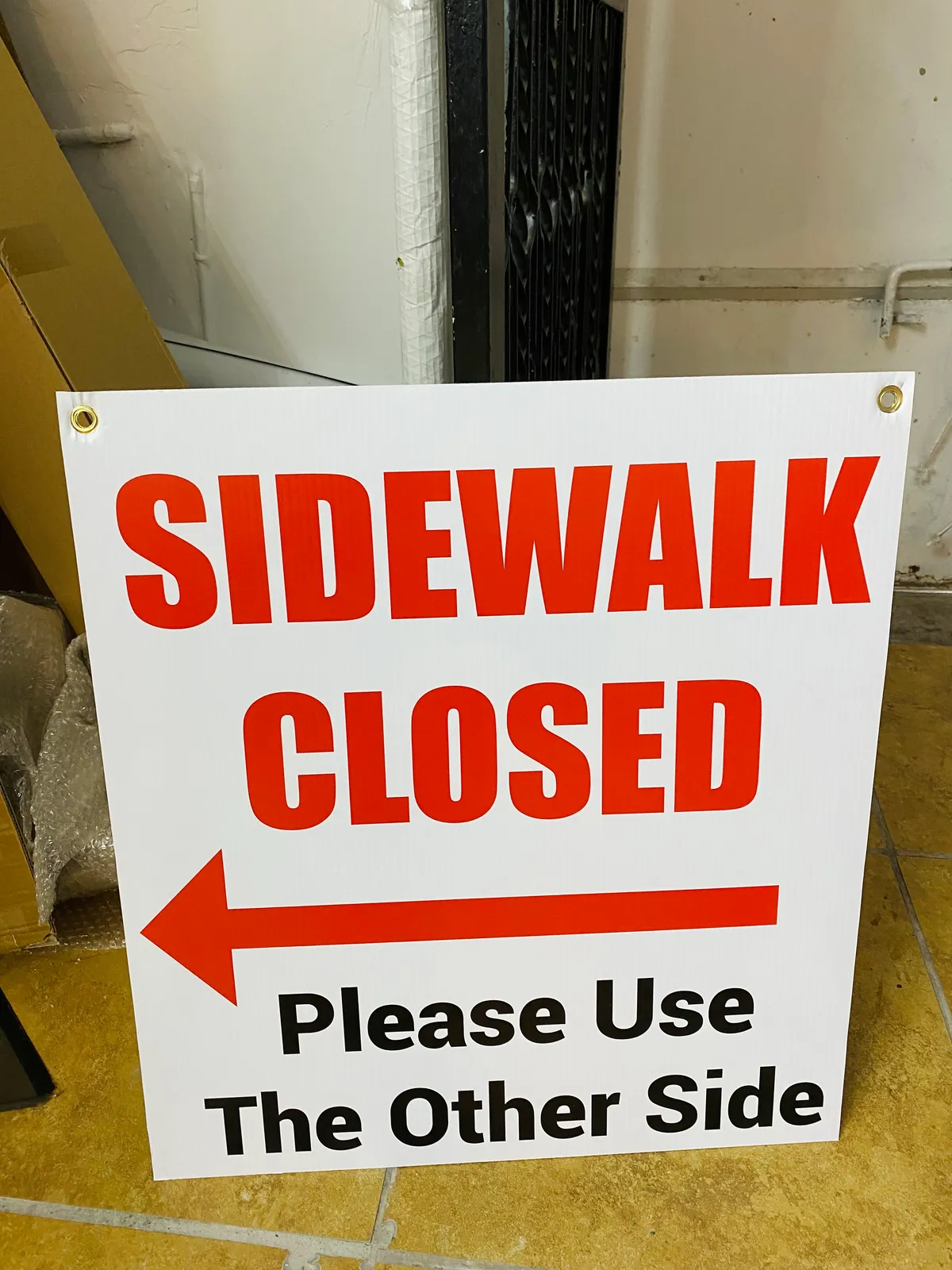 Sidewalk Closed safety sign for NYC construction site