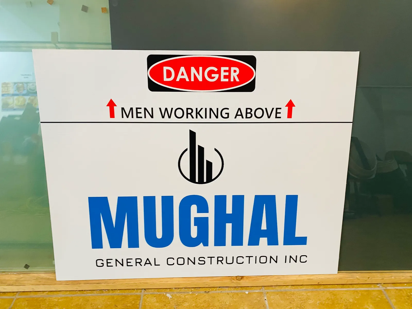 Danger Men Working Above construction panel sign in NYC