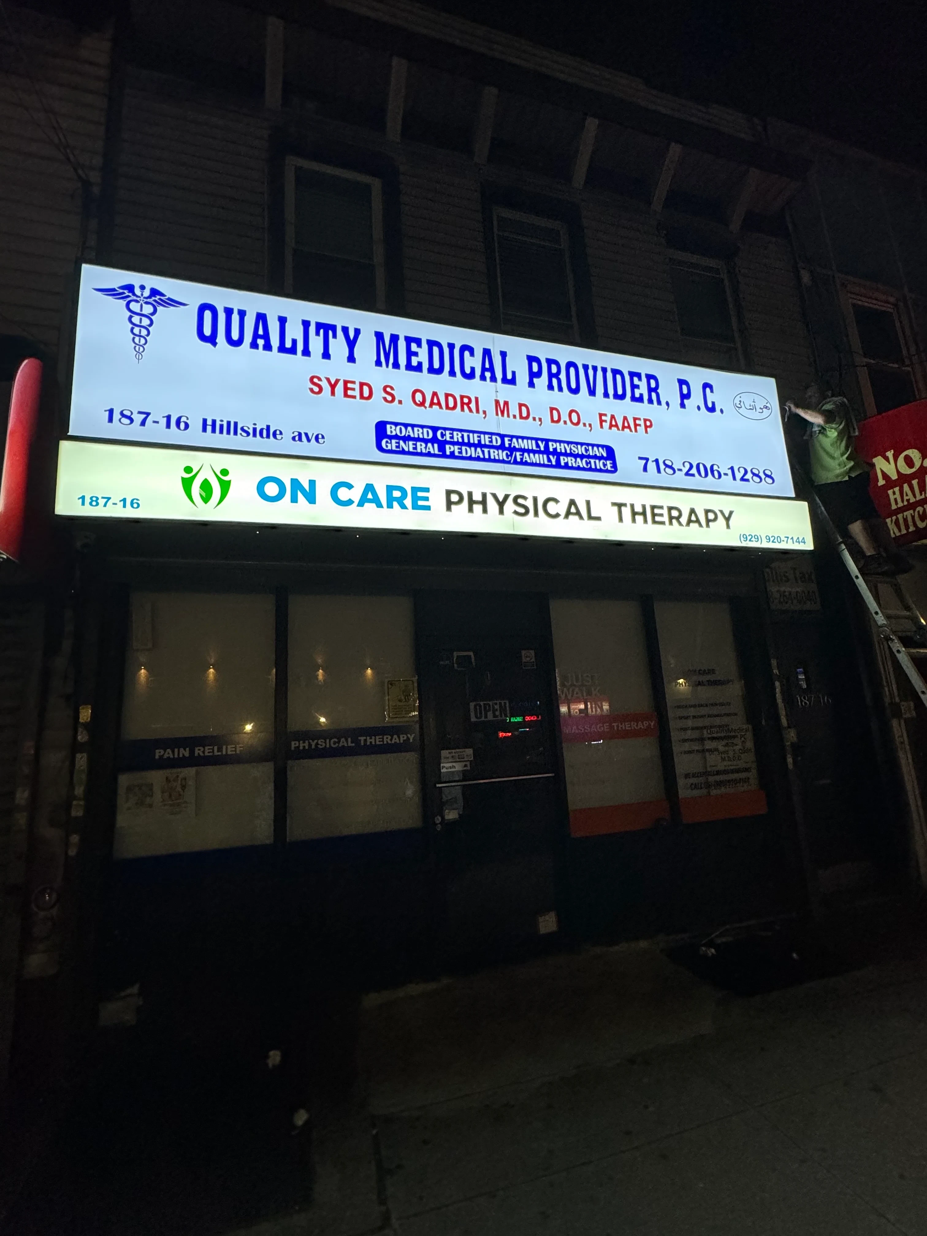Outdoor storefront sign with lighting