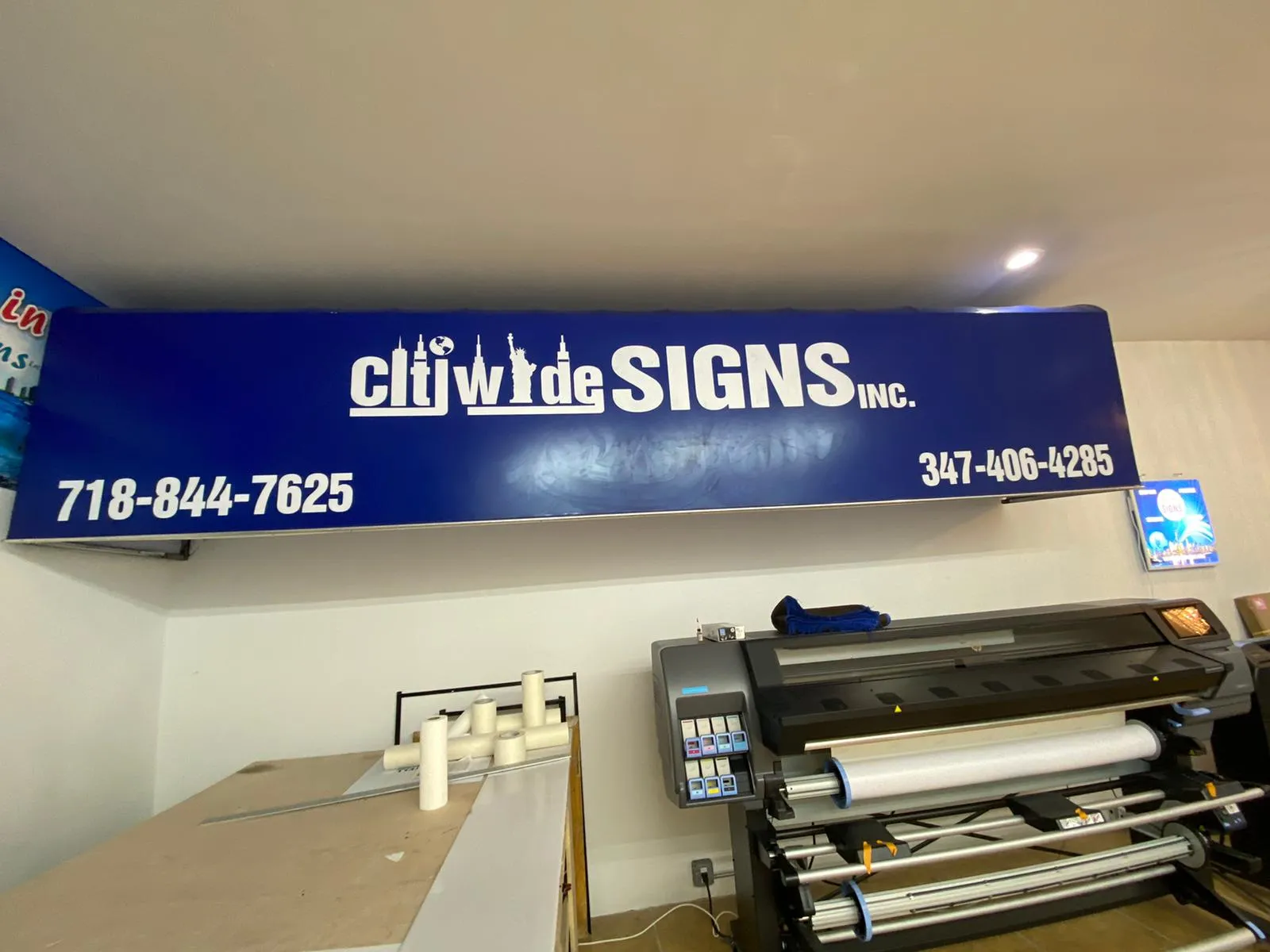 Citiwide Signs storefront awning sign above NYC sign shop