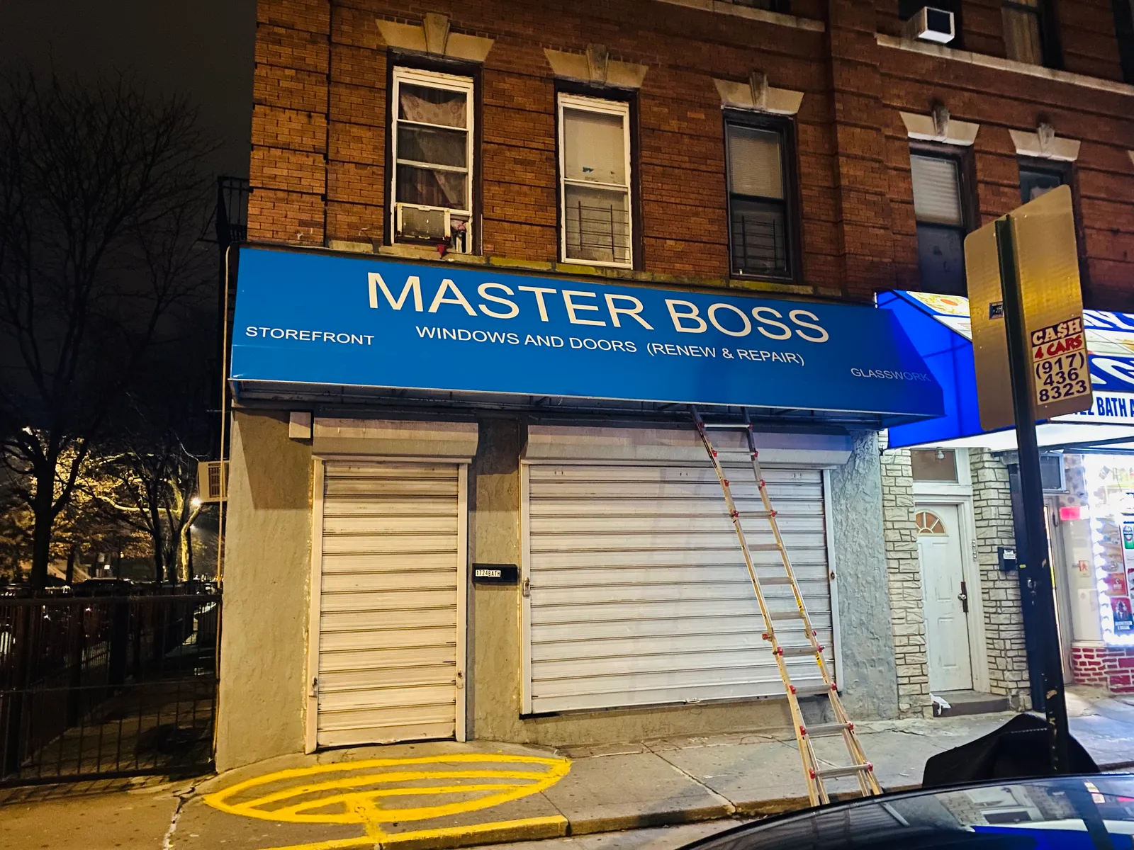 Master Boss windows and doors storefront sign in NYC